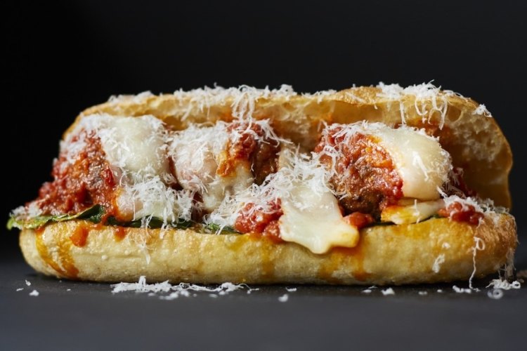 King William's Mamma Mia sub with free-range pork meatballs, spinach, sugo, basil salsa verde and a trio of Italian cheeses: provolone, scamorza, parmagiano.