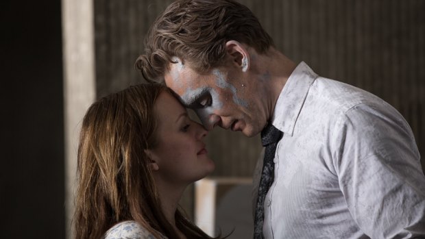 Tom Hiddleston as the cool observer Laing with the pregnant Helen (Elisabeth Moss), who is from the lower floors, in <i>High-Rise</i>.