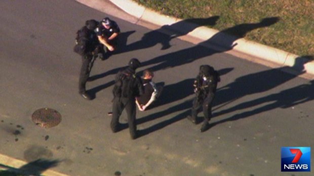 Police arrest a man after a siege at Caboolture.