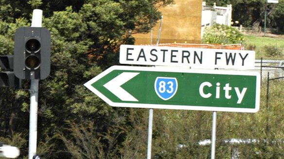 Four-wheel-drive rams motorcycle on Eastern Freeway