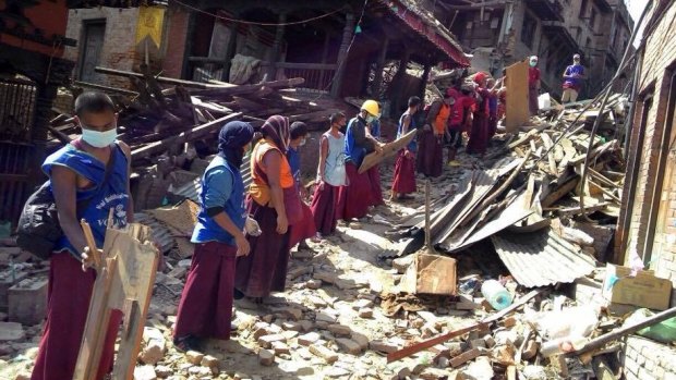 Survivors in Bhaktapur start the daunting task of rescue and recovery.