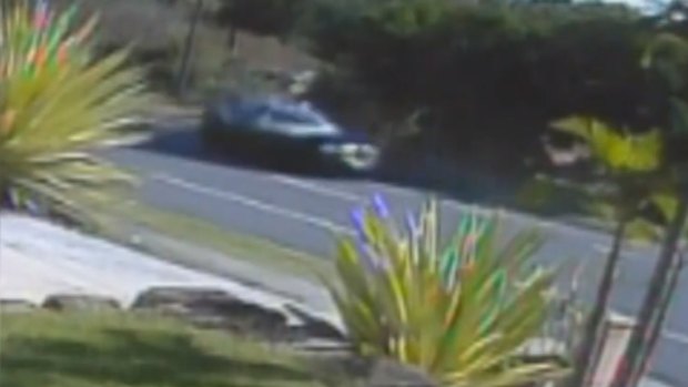 A damaged 4WD rolls along the road after Gold Coast mother Tara Brown was allegedly run off the road in another vehicle at Molendinar.