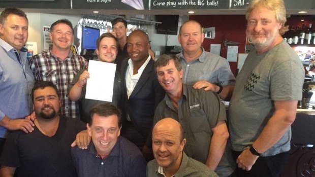 West Indian cricket great Brian Lara and members of the Bennett Hotel Centurions after he signed on with the club in Wickham on Friday.