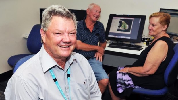 Professor Bryan Burmeister with melanoma patient Gordon Hughes from Mitchell and wife Valerie.