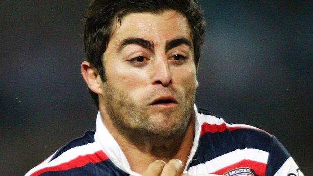 SYDNEY, AUSTRALIA - APRIL 04: Anthony Minichiello of the Roosters is tackled during the round four NRL match between the Bulldogs and the Sydney Roosters at ANZ Stadium on April 4, 2008 in Sydney, Australia. (Photo by Brendon Thorne/Getty Images) *** Local Caption *** Anthony Minichiello