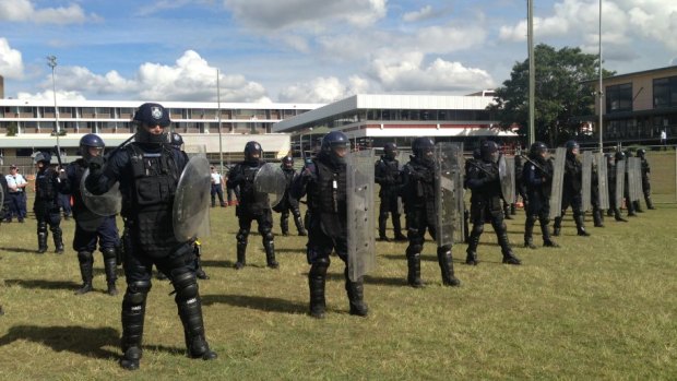Special Emergency Response Team officers go through a drill ahead of the G20 summit in Brisbane.