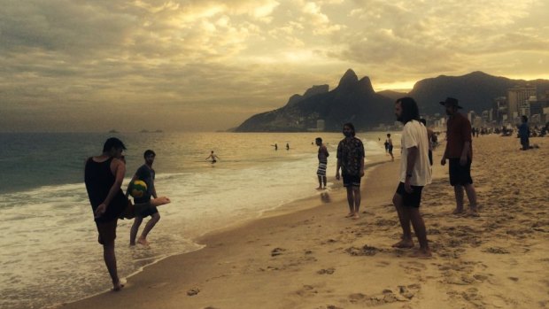 Tyson Perkins, Dylan Saulwick, Billy Wright, Matts Van Der Giessen and Daniel Head play football on a beach in Rio de Janeiro a day before the panic. 