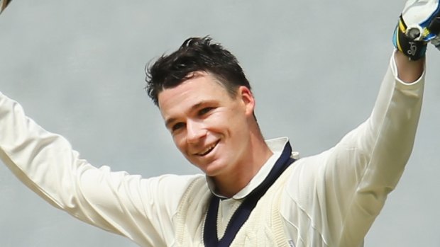 Peter Handscomb celebrates his century during the Sheffield Shield match against New South Wales on November 2.