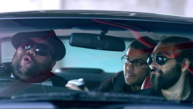 Briggs rapping, left, with Dan Sultan, back, and Trials, front right, in new music video January 26.