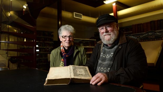 Volunteer Marion Blythman and Roger Burrows with the 1585 Breeches Bible.
