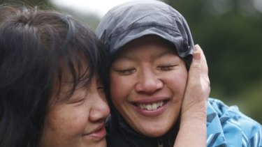 Susan O'Brien is hugged by her mother Maggie Khoo after she was found.