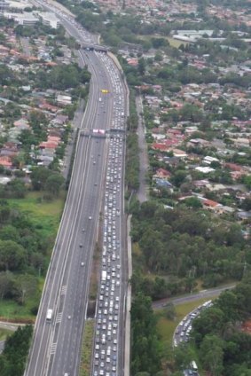 Traffic backs up on the Pacific Motorway after a crash on the inbound lanes at Holland Park.