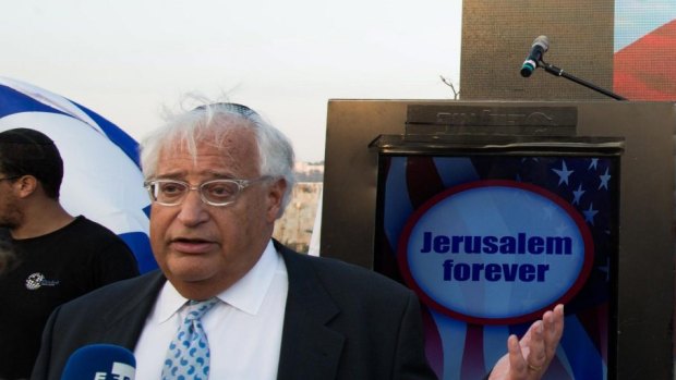 David Friedman, left, gives an interviews at a Trump campaign event titled "Jerusalem forever" in East Jerusalem in October.