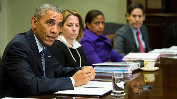 U.S. President Barack Obama speaks to the media, with Homeland Security Advisor, Lisa Monaco and National Security Advisor Susan Rice looking on, during a meeting on the government's Ebola response.