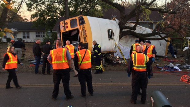 A school bus is wrapped around a tree at the scene of a crash in which multiple people have been reported dead in Chattanooga, Tennessee.