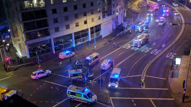 Emergency vehicles surround the scene of the fatal crash in Darling Harbour. 