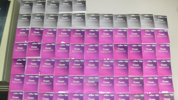The iTunes gift card backings kept by the Canberra woman defrauded by a telephone scammer.