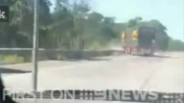 The woman filmed as the truck swerved over the road before crashing down the embankment. 