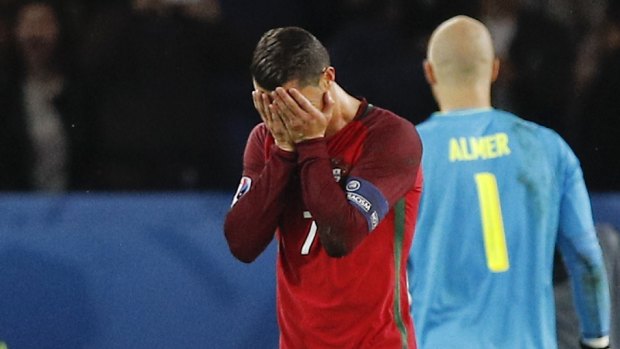 Ronaldo can't believe he's missed a spot kick against Austria.