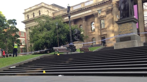 Police investigate a stabbing outside State Library Victoria.