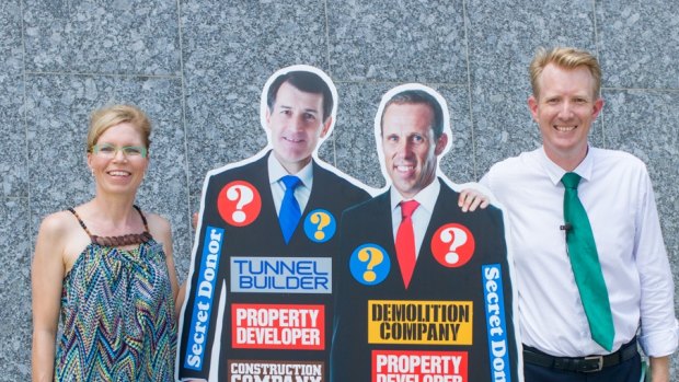 Greens lord mayoral candidate Ben Pennings and Jamboree ward candidate Dorotee Braun paraded a cardboard cutout to highlight political donations.
