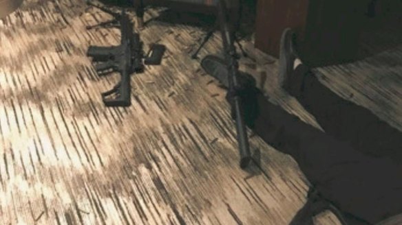 Photos from inside the Las Vegas gunman's hotel room show his body on the floor beside assault rifles, bullets and a bipod.