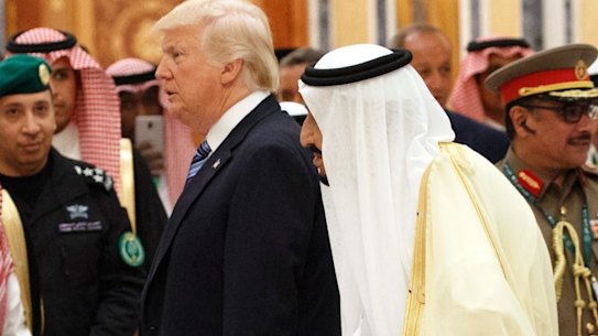 Saudi King Salman and US President Donald Trump arrive at the Arab Islamic American Summit, at the King Abdulaziz Conference Centre, on Sunday.