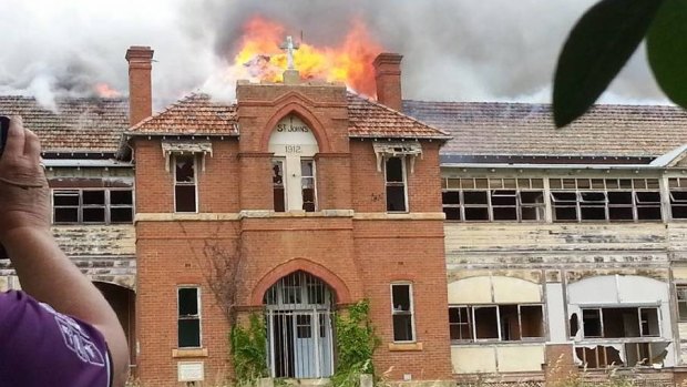 The former boys' home St John's burned on Wednesday, but fire investigators say the blaze is not suspicious.