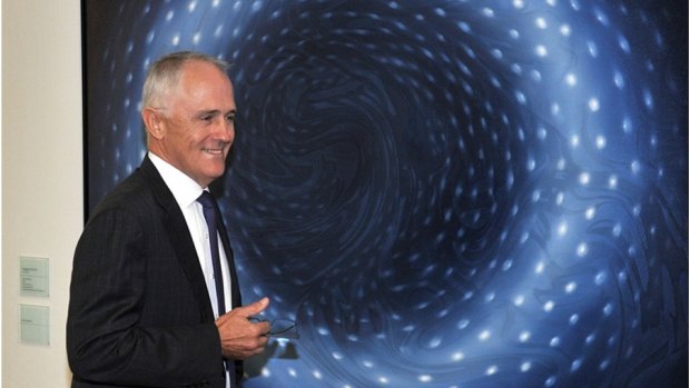 Malcolm Turnbull in front of Megan Walch's artwork, "Blue Donut", at Parliament House.
