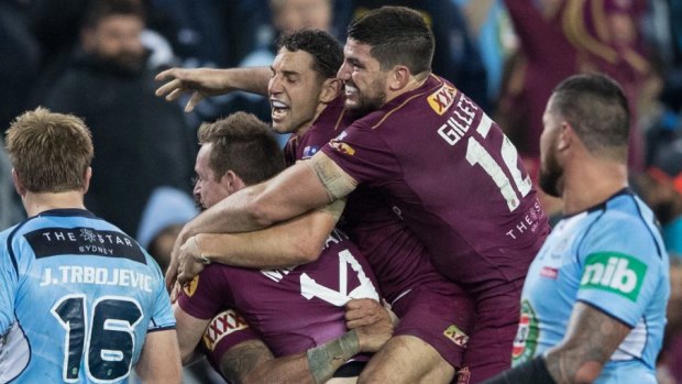 Irrepressible: Dane Gagai celebrates a crucial Queensland try at the death with Michael Morgan, Billy Slater, Matt Gillett and Cameron Smith near the conclusion of Origin II in Brisbane last month.