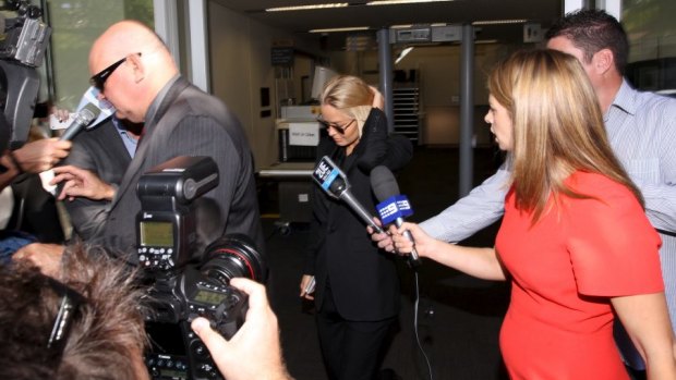 Lara Bingle leaves court for sentencing after a driving offence.