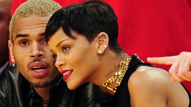 Happier times ... Chris Brown and Rihanna attend an NBA  game in 2012.