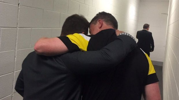 Alastair Clarkson and Damien Hardwick share a moment after the grand final.