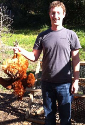 Mark Zuckerberg with a chicken, following his pledge to only eat vegetables or animals he had slaughtered himself.