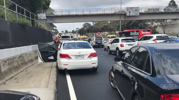 Traffic is at a standstill on the Tullamarine Freeway after high-voltage power lines came down. 
