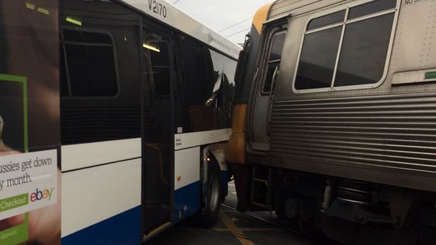 A bus has been hit by a train in the Brisbane suburb or Alderley.