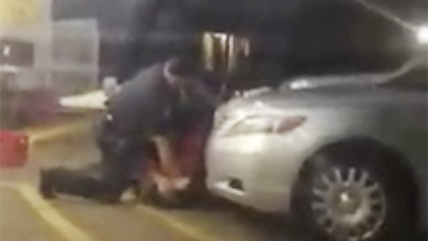 Alton Sterling is detained by two Baton Rouge police officers outside a convenience store. Moments later, one of the officers shot and killed Sterling.