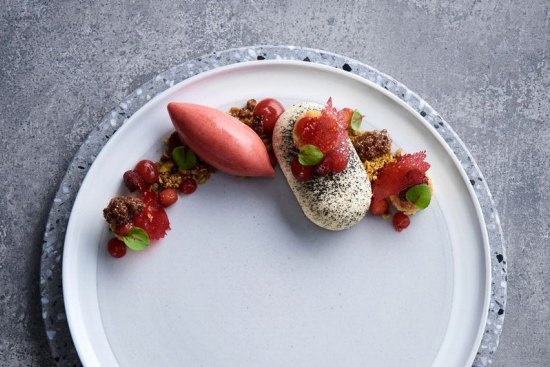 Main Ridge goat's cheesecake with strawberries, balsamic, pistachio and strawberry sorbet.