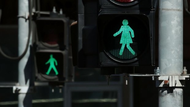 Female traffic light signals installed at the intersection of Swanston and Flinders streets.