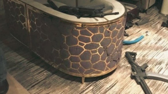 An image from the hotel room of Las Vegas killer Stephen Paddock shows guns, ammunition and suitcases.