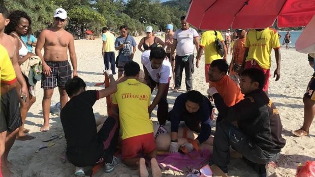 Lifesavers try to save Victorian tourist Emily Jayne Collie on Phuket's Karen Beach.