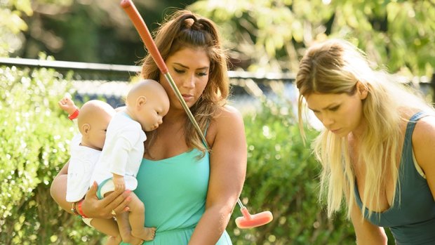 The Bachelor Australia contestants with their baby simulators. 