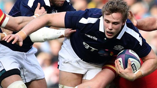 Scotland's Jonny Gray is brought to the ground.