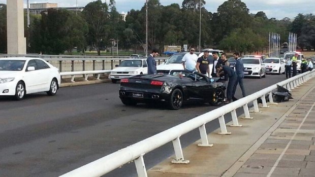 Police blocked parts of Commonwealth Avenue Bridge after the smash on Easter Sunday. The black Lamborghini was decorated with ribbons for a wedding.