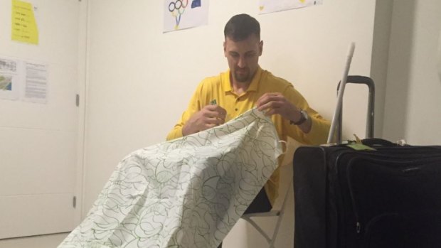 Shower scene from Rio: Andrew Bogut putting the shower curtain up in his bedroom