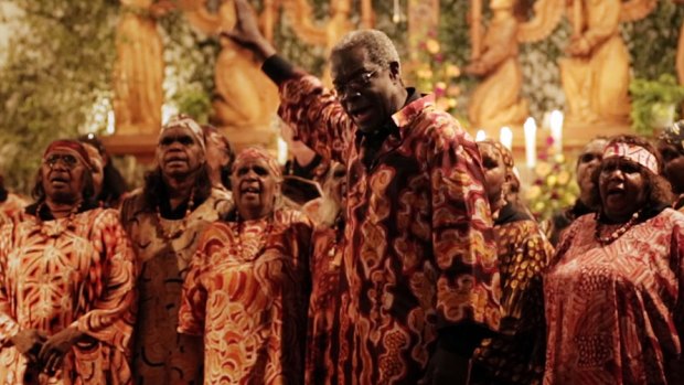 Choirmaster Morris Stuart conducts the Central Australian Aboriginal Women's Choir.