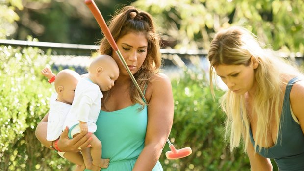 The Bachelor Australia contestants with their baby simulators. 