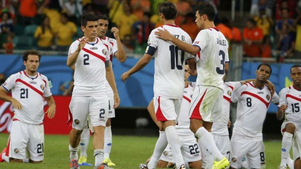 End of the adventure: Costa Rica's Bryan Ruiz is consoled after his penalty was saved.
