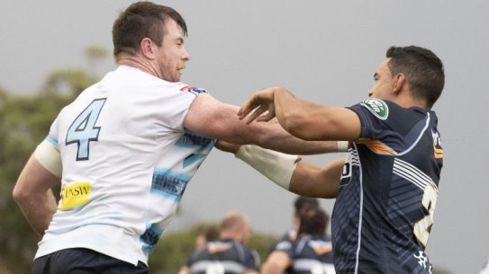 The Waratahs' Jed Holloway gets in the face of the Brumbies' Wharenui Hawera. Photo: Sitthixay Ditthavong