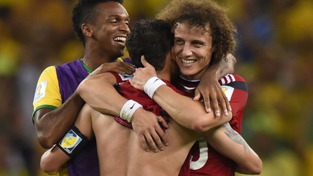 Always looking on the bright side: David Luiz celebrates the win over Colombia.